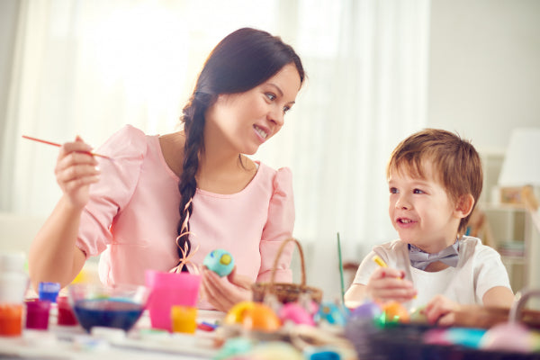 the power of positive thinking woman and child doing crafts to increase positivity