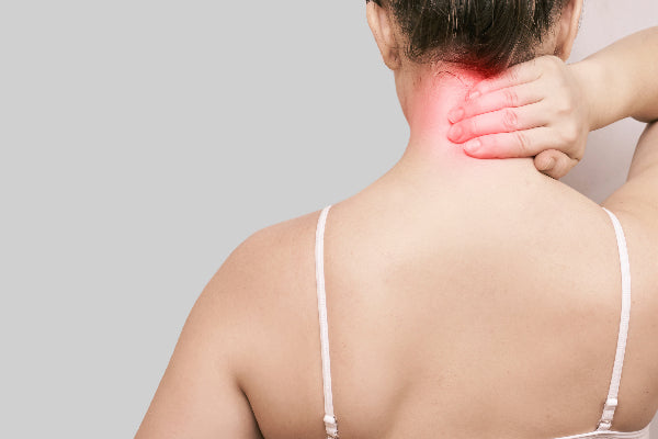 what is occipital neuralgia occipital neuralgia causes symptoms and treatments for occipital neuralgia woman in white tank top holding back of neck