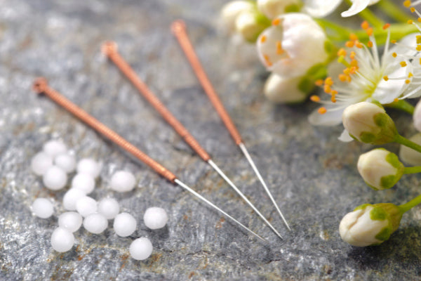 what is osteoporosis the causes symptoms of osteoporosis and natural remedies for osteoporosis close up of acupuncture needles