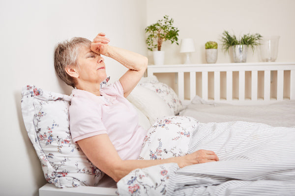 what is vasculitis causes symptoms of vasculitis what natural treatment for vasculitis may help elderly woman laying in bed flowered bed set exhausted from vasculitis