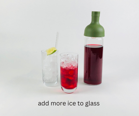 fully iced glass half-filled with organic elderberry hibiscus tea