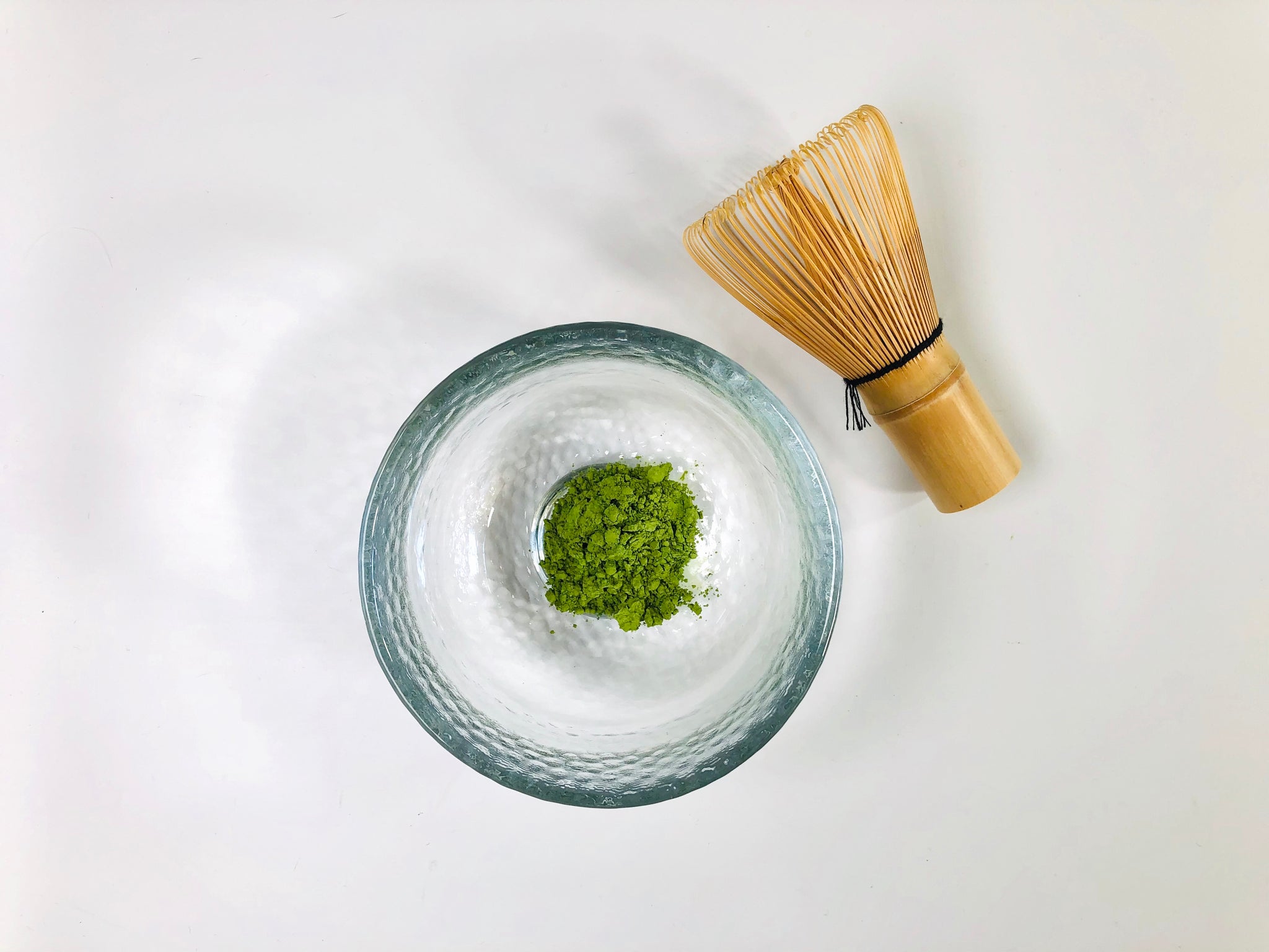 matcha bowl with matcha powder and whisk