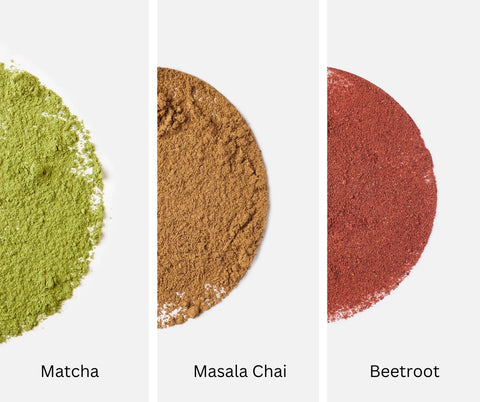 Overhead view of matcha powder, masala chai powder and beetroot powder