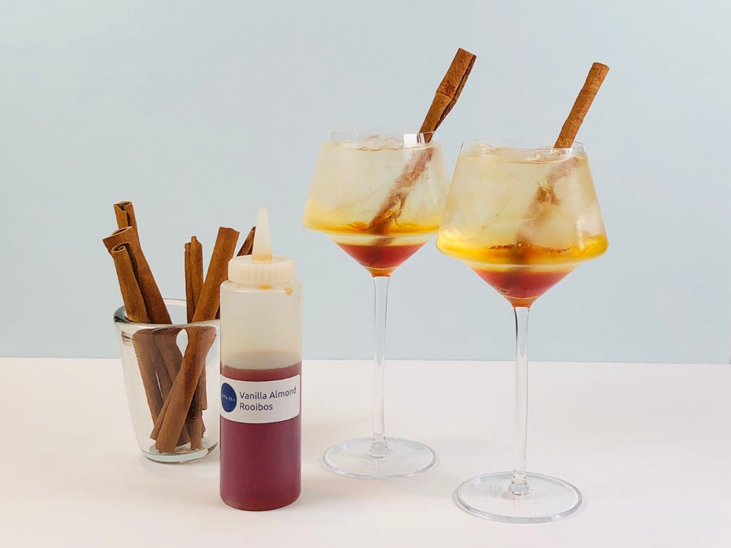 vanilla spritz drinks with cinnamon sticks and vanilla almond rooibos simple syrup