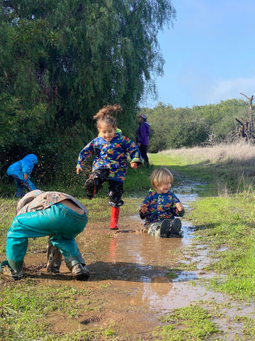 Children playing in a marsh wetland