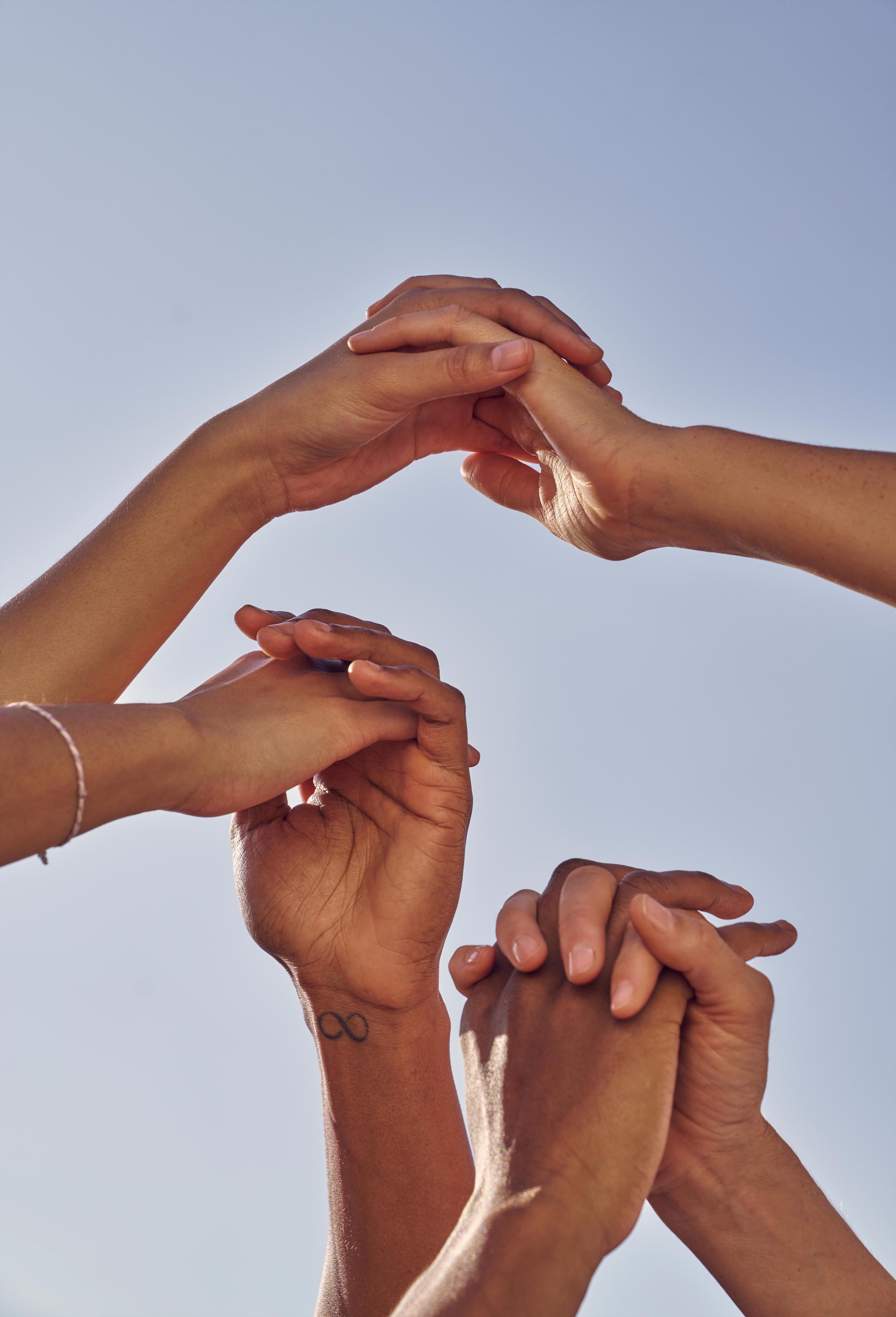 Group of hands interlocked and