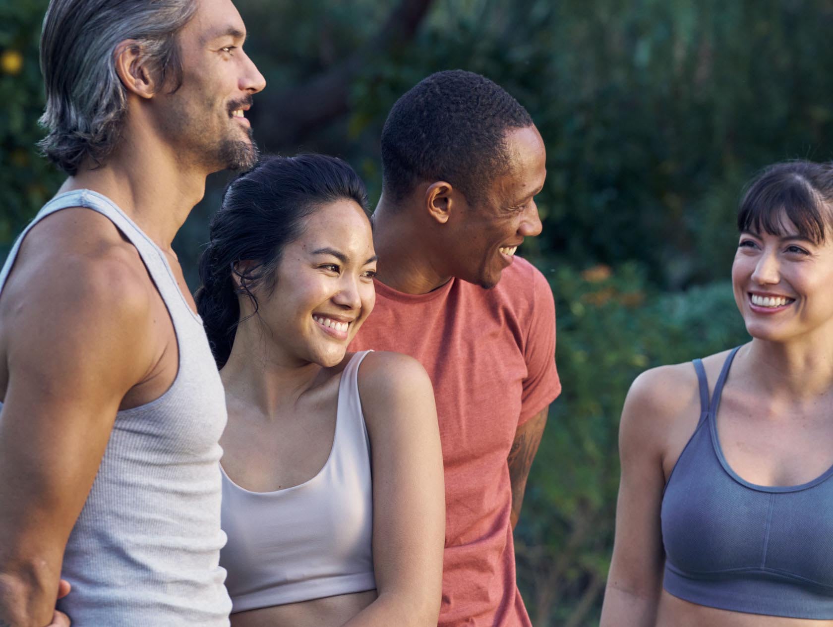 Group of 4 yoga practitioners smiling
