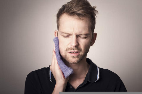 Man suffering from tooth pain