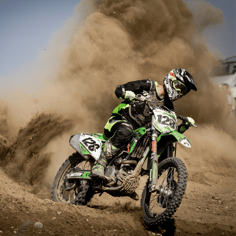 Motocross biker riding on a flat-track (dirt track)