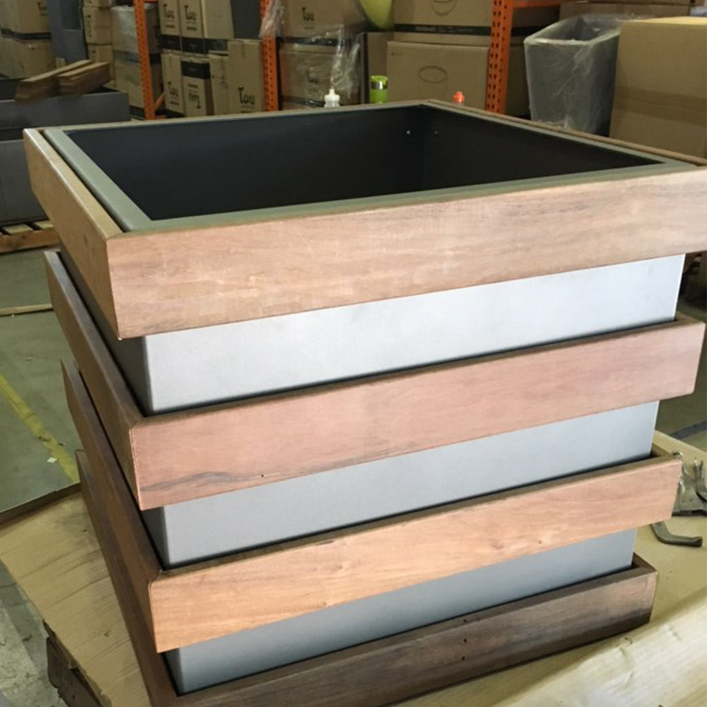Wood-clad aluminum planter in shop | PureModern