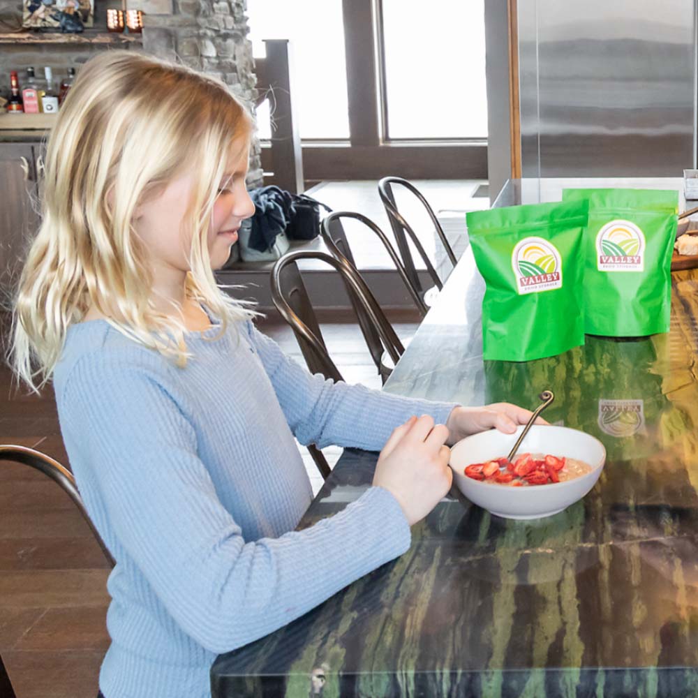 A girl eating eating a gluten free breakfast