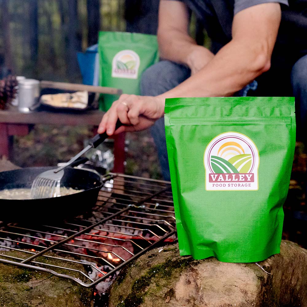 Cooking gluten free survival food over a campfire