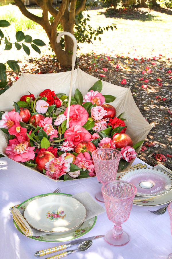 A floral filled umbrella centerpiece from Libbie Summers