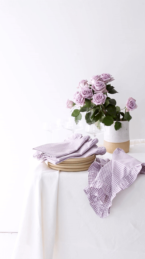 https://eoc32apdyzm8gjsu-13278117946.shopifypreview.com/collections/home/products/ruffled-napkin-set-in-lavender-gingham-set-of-4