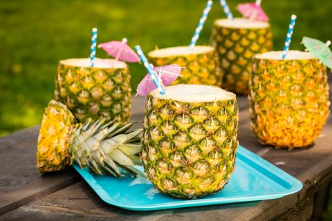 pineapple colada cocktail mixed drink in a pineapple