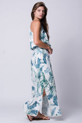 woman in long floral maxi dress tropical print