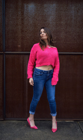 woman in pink sweater and high heels 