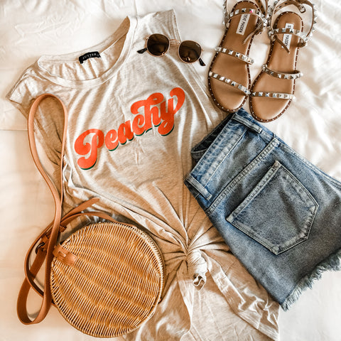 peachy graphic tee with denim shorts and steve madden shoes