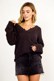 woman in frayed distressed sweater