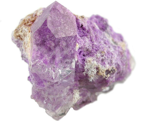 A picture of a genuine sugilite gemstone (By Rob Lavinsky, iRocks.com – CC-BY-SA-3.0, CC BY-SA 3.0, https://commons.wikimedia.org/w/index.php?curid=10419460)