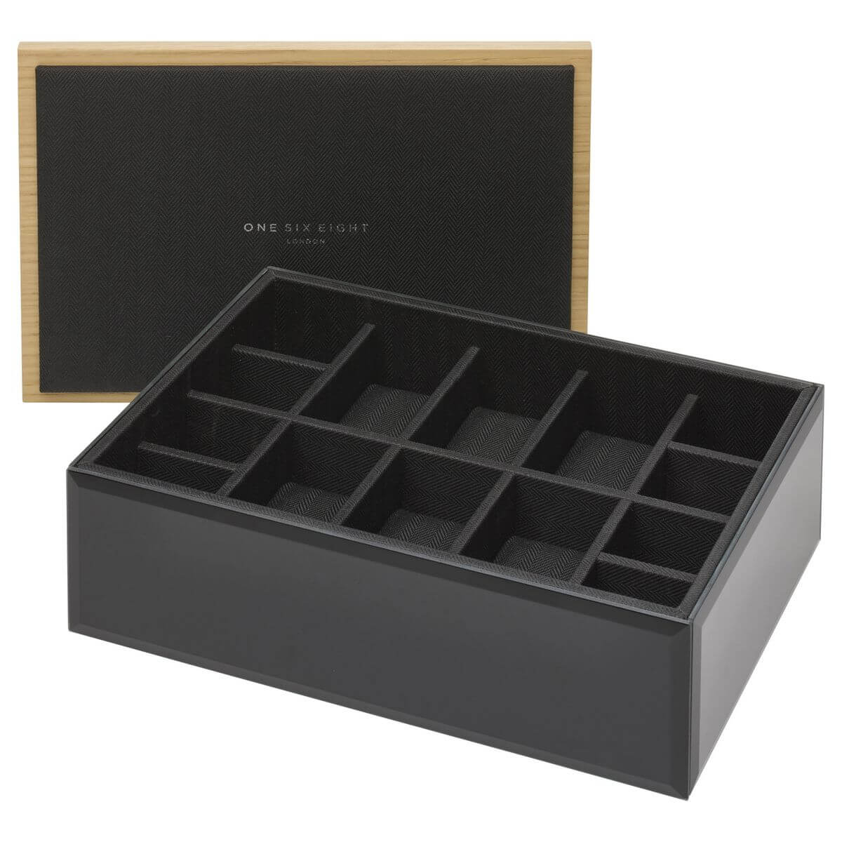 A black glass watch storage box with black herringbone inner lining and wooden lid
