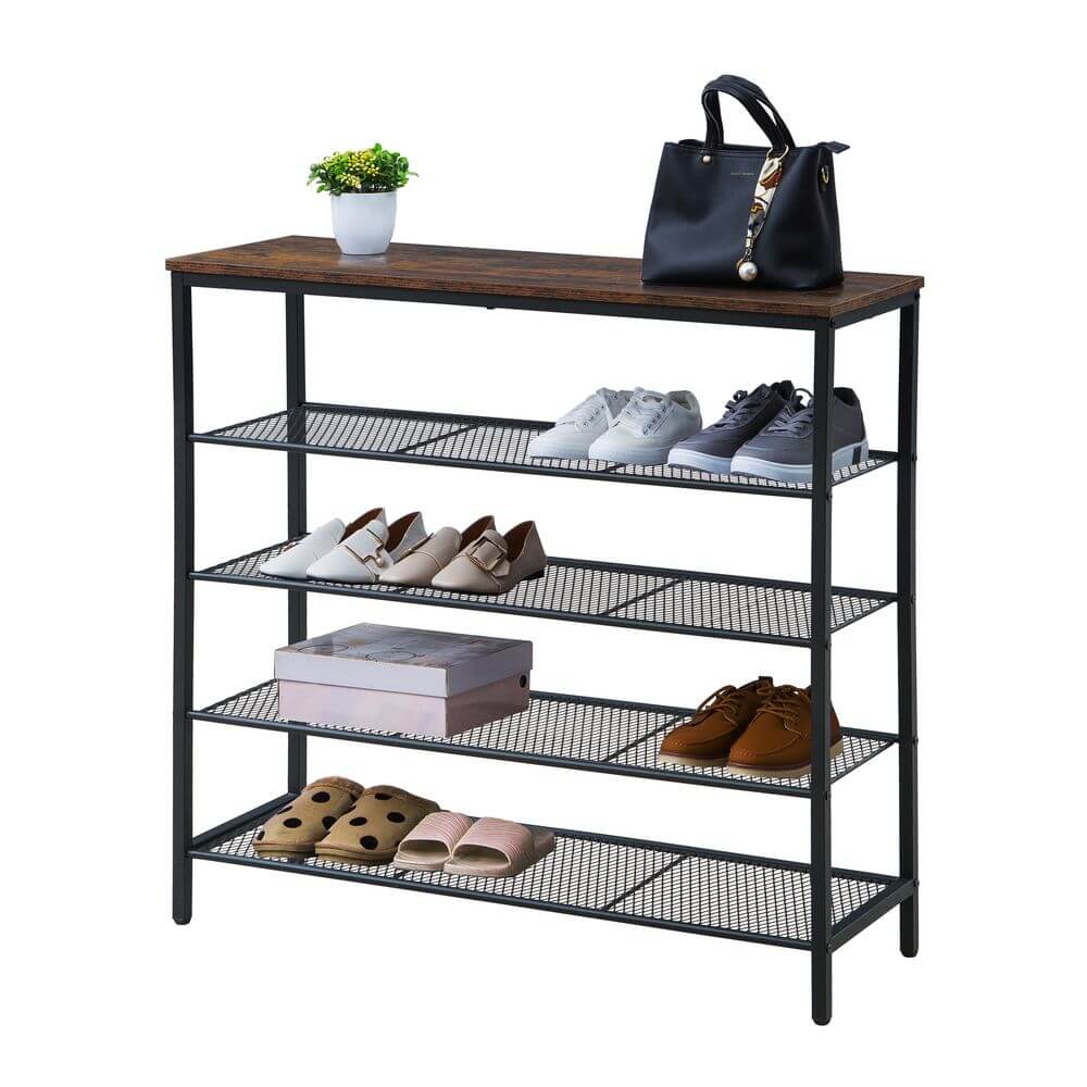 A matte black shoe rack with solid timber top. Shoes are stored on the mesh shelves, and a handbag and pot plant on the top shelf.