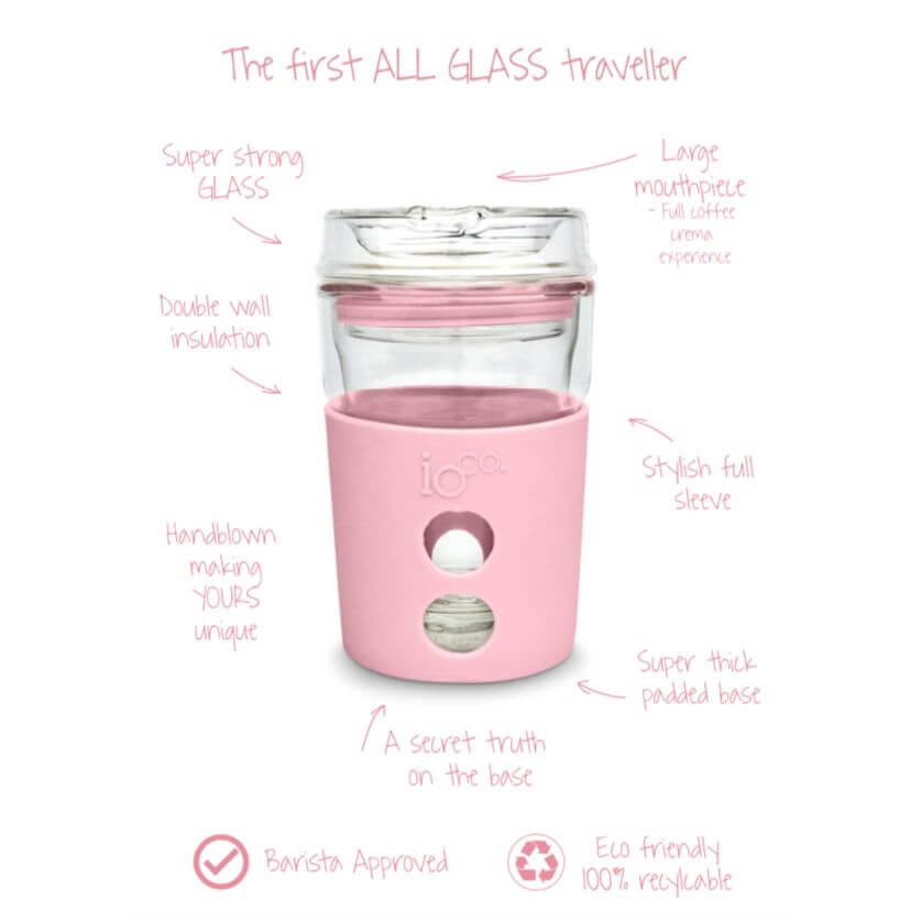 An all glass reusable travel coffee cup with pink silicone hand grip and leak-resistant seal