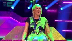 Female contestant covered in green slime