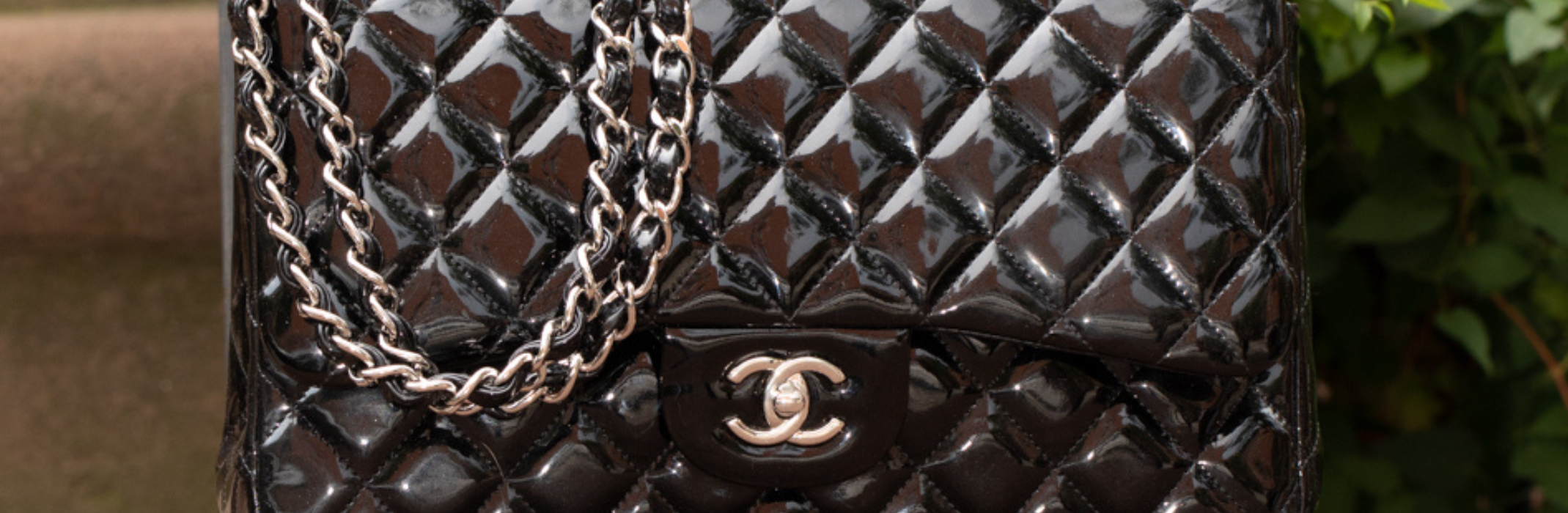 Chanel Logo Oval Lambskin Cross Body Bag