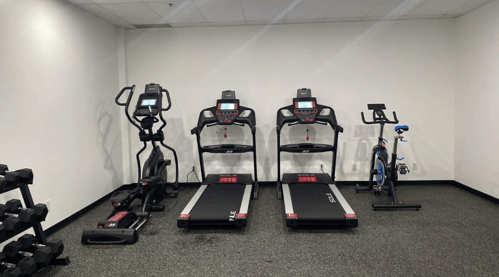 treadmills and elliptical gym in a car dealership