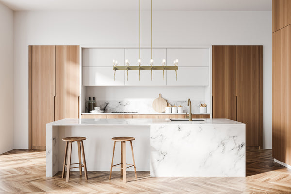 Contemporary style chandelier showcased above a modern kitchen island.