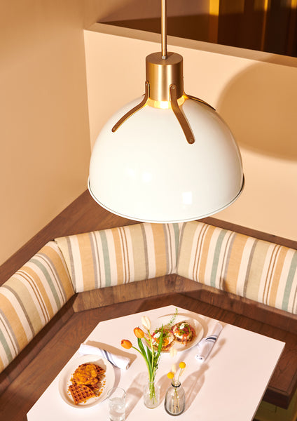 Mid-Century Modern Style Pendant Lighting showcased above a cafe table.