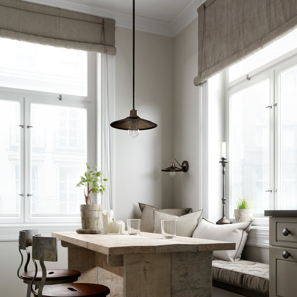 Matching Industrial Style Pendant Light and Wall Sconce showcased in corner breakfast nook setting.