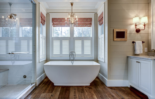 A Crystal Mini-Chandelier Above A Bathtub for an Elegant Bathroom Retreat.