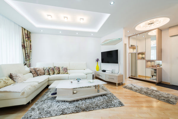Recessed and Cove Lighting showcased in a small living room space.