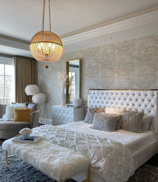 Orb pendant light showcased as a statement piece in a glamorous bedroom setting.