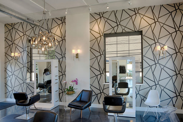 Modern Pendant Lights and Wall Sconces showcased in a Contemporary style Salon.