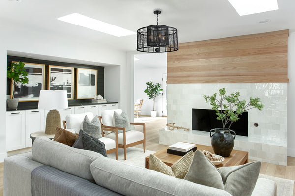 A cage style chandelier showcased in a modern living room setting.