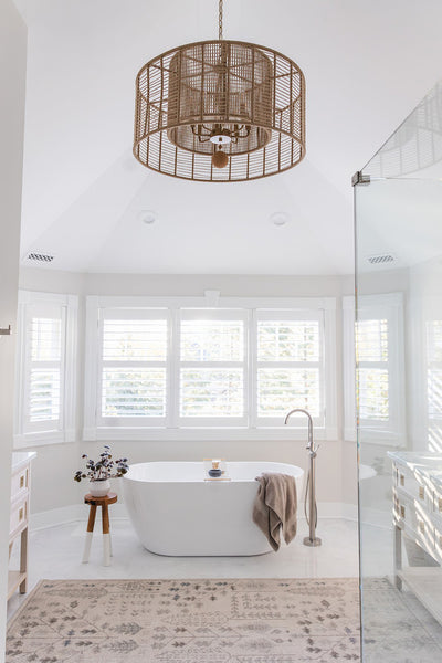 A Natural & Organic Style Chandelier showcased in a modern style bathroom setting.