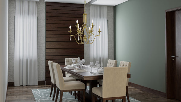 Transitional style chandelier in brushed brass showcased above a dining table.