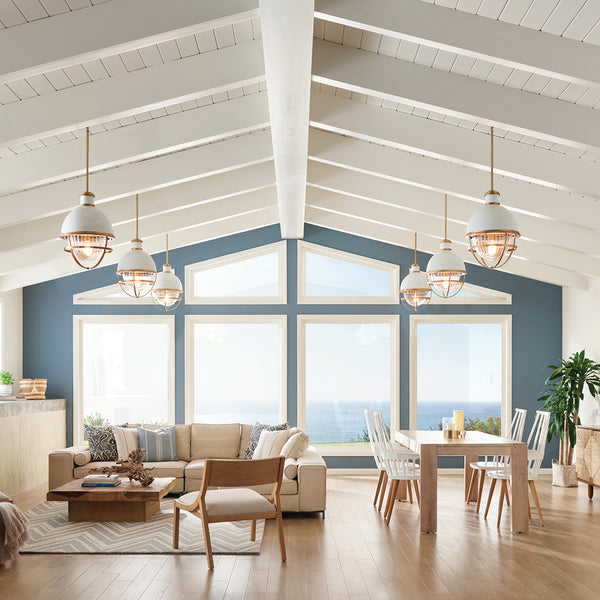 Coastal themed living room showcasing nautical style pendant lights.