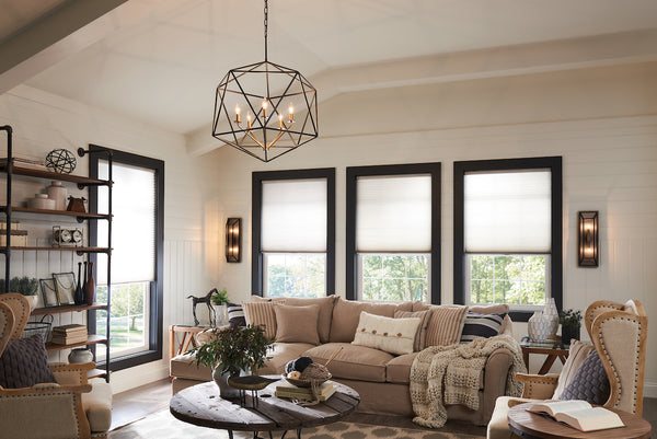 A geometric chandelier showcased in a living by Hinkley Lighting