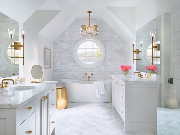 A transitional style crystal chandelier showcased in a modern bathroom setting.