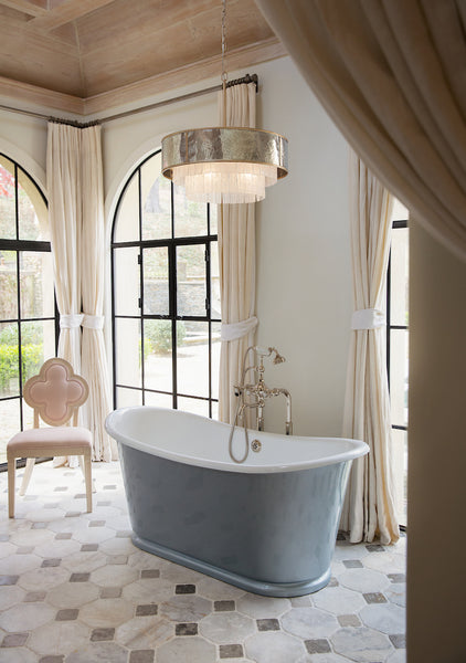Delicate Chandelier showcased above a bathtub for Accent Lighting in a Luxury Bathroom.