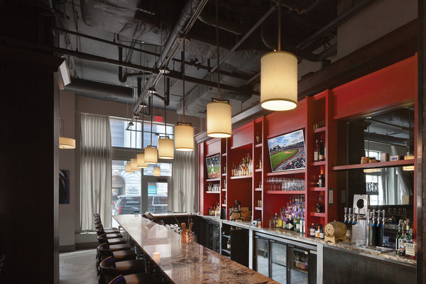 Hinkley pendant lights showcased above bar.