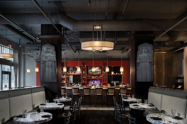 Hinkley's Hampton Collection of Pendant Lighting in full display at a restaurant and bar.