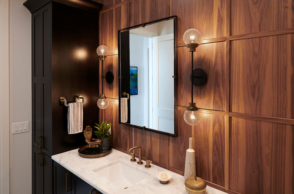 A pair of artistic Vanity Wall Lights showcased in a bathroom.