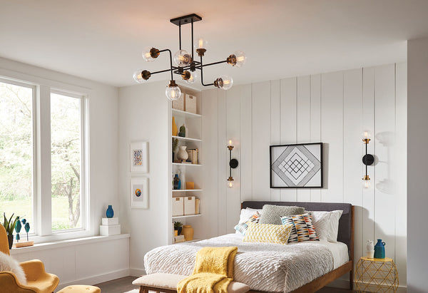 A Farmhouse style bedroom showcasing an Industrial Sputnik designed chandelier.