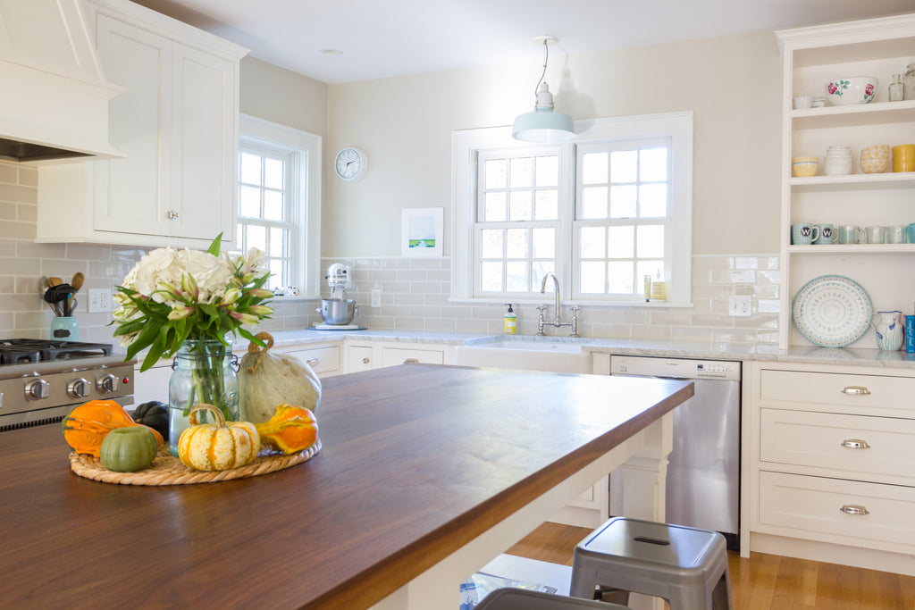 White Shaker Style Kitchen Cabinetry Walnut Island Countertop