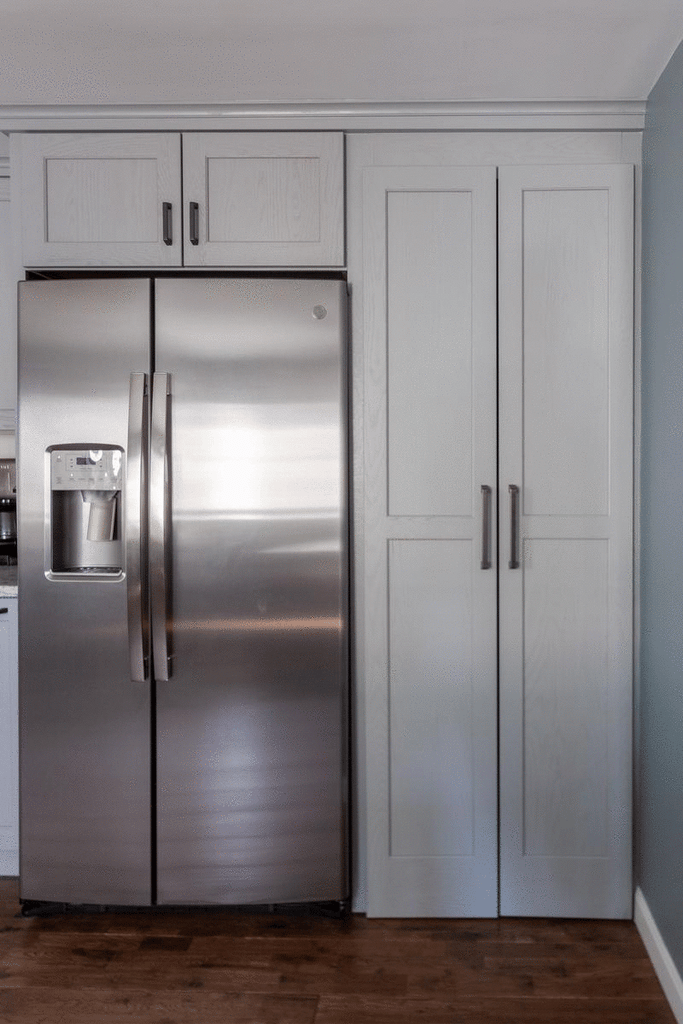 Hidden pantry closet by Medallion Cabinetry